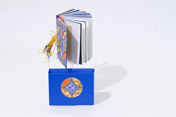 _Khera_sm blue woven spine bk_$35