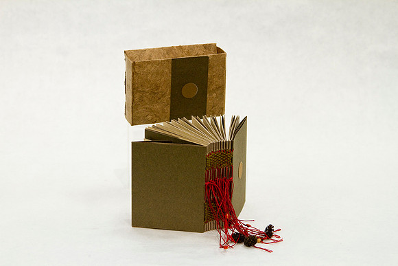 _Khera_sm Brown woven spine bk_$35